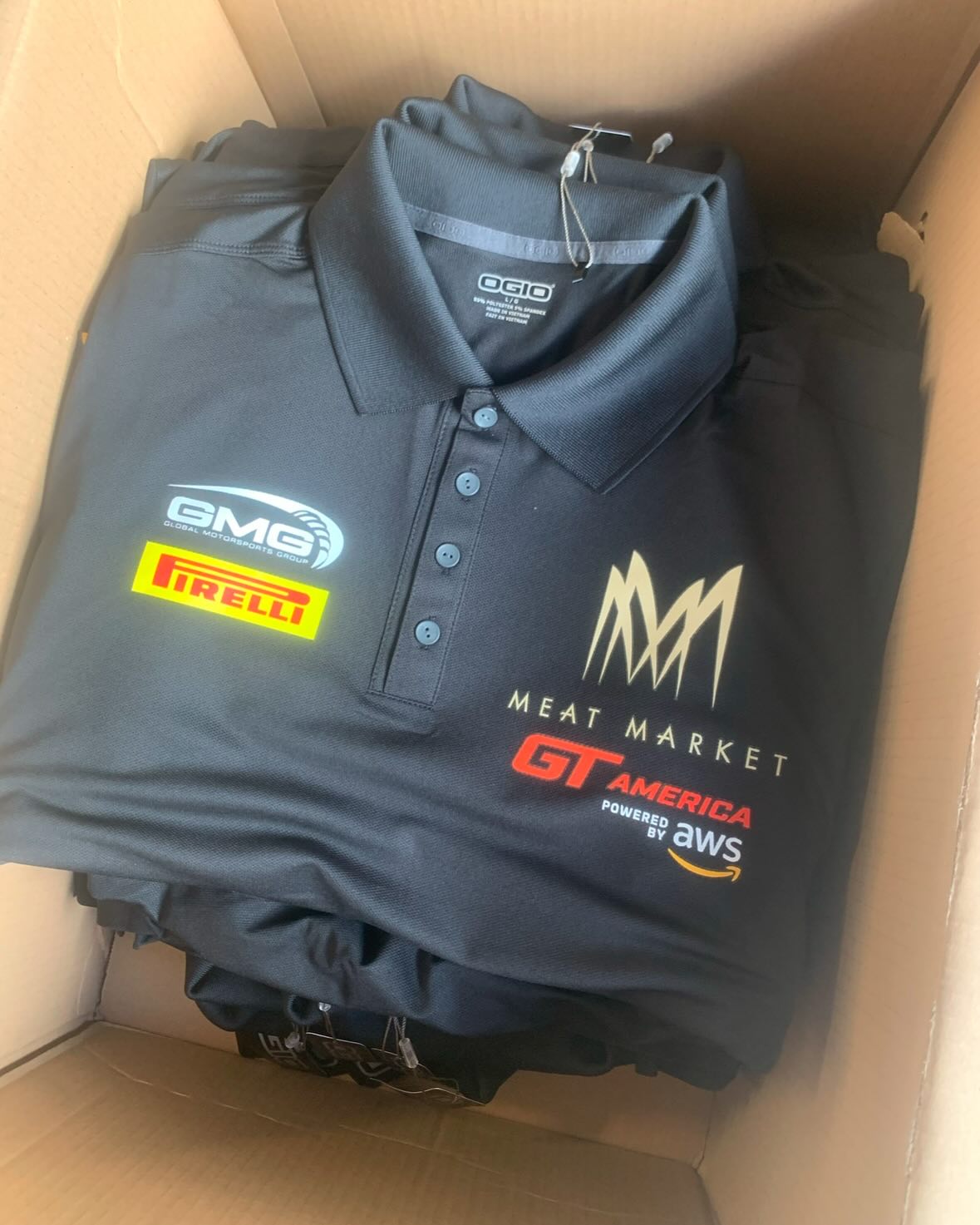 Folded, custom-branded apparel packed and ready to ship